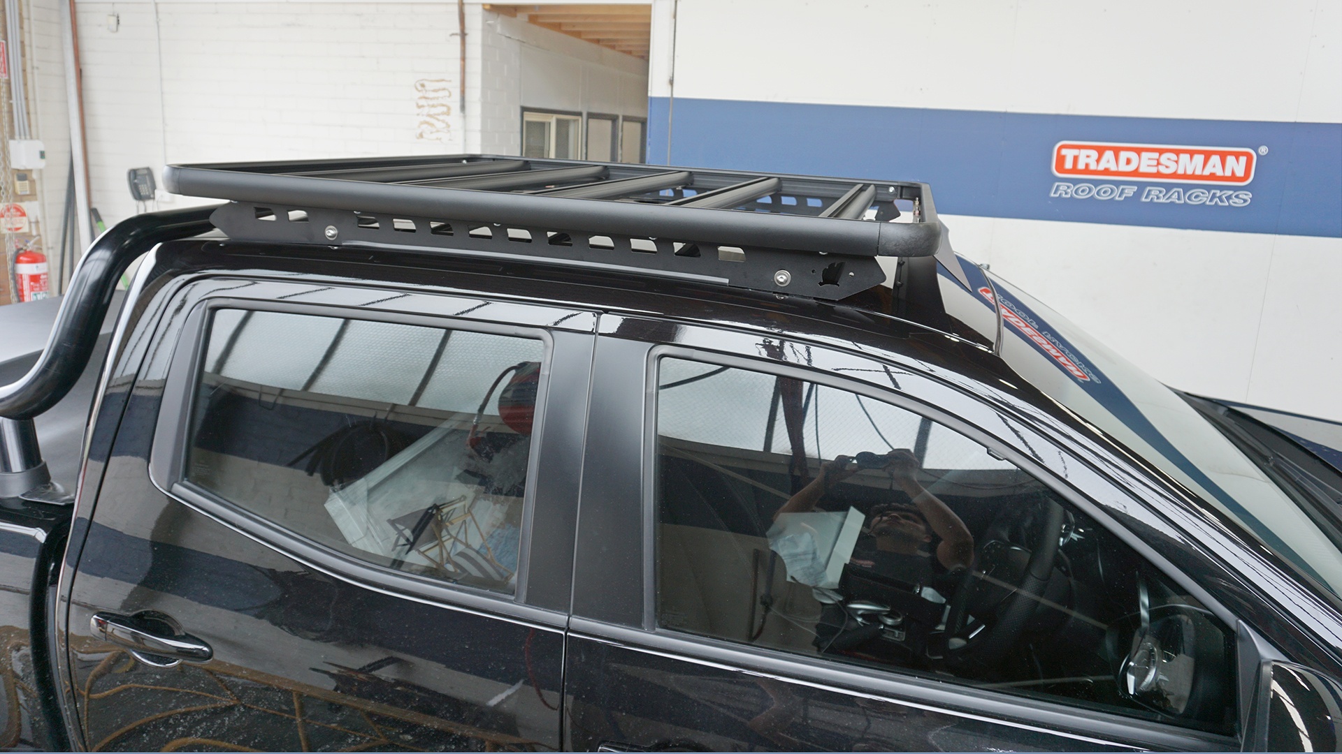 Raised side view of Navara with a Wedgetail roof rack installed showing the one piece mounting rails and the five cross bards used in the construction of the platform.