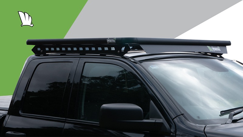 Side view of Dodge RAM 1500 with a Wedgetail roof rack installed on the cabin roof showing the mounting rails and the wind deflector.