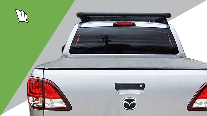 Mazda BT-50 rear view with a Wedgetail platform roof rack installed on the roof.