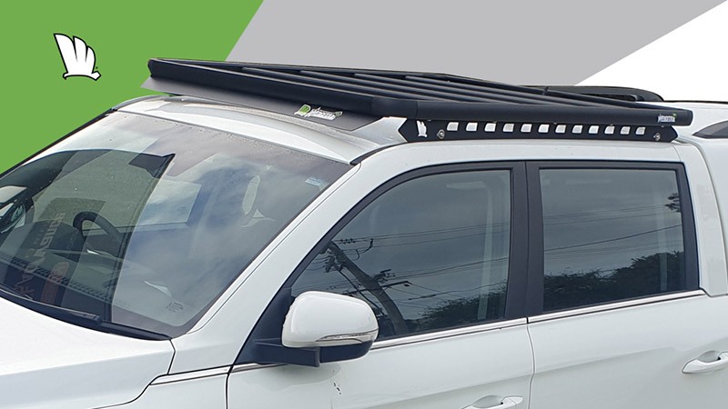 Front and side view of the SsangYong Musso 2021 with a Wedgetail rack installed on the cabin roof showing the super strong platform with five cross bars, the wind deflector on the front and the one piece mounting rails.